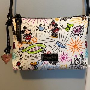 Dooney and Bourke pouchette in Disney Sketch print